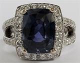 Lot#1070, 12.74CT SAPPHIRE & DIAMOND RING, GIA, SIZE 8.75//18kt white gold ladies ring, featuring a 12.74 carat no heat color change cushion modified brilliant cut sapphire, prong set at the center, surrounded by 4.50 carats of round side diamonds. Measuring approximately 13.6 grams in total weight, size 8.75. GIA report included.