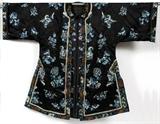 Lot#1138, CHINESE SILK EMBROIDERED ROBE, C. 1880, L 42"Manchu style dark blue silk tea robe embroidered in blue and white silks with flowers, gold thread accents.