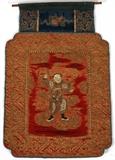 Lot#1141, CHINESE SILK & GOLD THREAD EMBROIDERED PANEL, LATE 19TH C., 16 1/2" X 11"A rectangular silk panel with notched corners featuring a warrior holding a sword at the center, within a fret border, backed with blue linen.