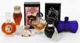 Lot#1330, FRENCH CRYSTAL PERFUME BOTTLES, SEVEN, H 3"-5", INCLUDING BACCARAT & 'ZUT' BY SCHIAPARELLI/Including 1 Baccarat cobalt blue perfume bottle for Guerlain, in the shape of a bow, H.3", W.4";  1 Schiaparelli "Zut", H.4 3/4"; 1 Jean Desprez "Bal a Versailles" perfume decorated with a Fragonard image, H.4 3/8", with box; 1 "Pavlova" with Russian style lacquer box signed "Nona"; 1 Guerlain "Shalimar", H.4", with box; 1 Borghese with box; and 1 Floral Danica with box.