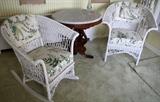 Lot#1457, PAINTED WICKER ARMCHAIR & ROCKER, C. 1920//Painted white, Having upholstered backs, with loose upholstered spring cushion seats. Including one armchair, together with one rocking chair. Circa 1920.