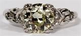 Lot#2076, ANTIQUE 1.33CT DIAMOND RING, SIZE 6//Platinum antique ladies ring, featuring a 1.33 carat Old Mine cut round diamond at the center, flanked by 0.10 carats of side diamonds. Measuring approximately 3.9 grams in total weight, size 6.