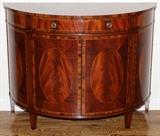 Lot#2199, ENGLISH FIGURED MAHOGANY DEMILUNE COMMODE, H 36", W 47", D 21"Satinwood string inlay; single drawer, double doors; later 20th c.