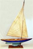 Lot#2228, MELAT & PAINTED WOOD POND BOAT, C. 1940'S, H 101", W 14.75", L 72.5"Painted blue with turquoise keel on stand, has linen sails. Original owner sailed this pond boat  in Central Park, New York, as a young man before moving to Michigan.