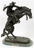 Lot#8, AFTER FREDERIC REMINGTON, BRONZE SCULPTURE, H 22" L 15", "BRONCO BUSTER"signed on bronze base. Mounted to green marble base with inscribed brass plate: "Bronco Buster By Frederic Remington".