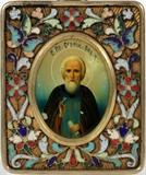 Lot#15, RUSSIAN '84' SILVER AND ENAMEL TRAVELING ICON, H 3 1/2", W 2 1/4", ST. SERGIUS OF RADONEZH//having a Russian '84' silver frame with painted enamel flowers with a miniature painted oval icon of St. Sergius, 3 1/2" x 2 1/4" oval. Russian hallmarks on side edge of frame.