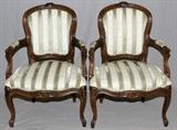 Lot#57, LOUIS XV STYLE WALNUT OPEN ARM CHAIRS, H 34", W 24", L 24"having carved walnut frames, striped upholstery with wreath designs, trimmed in brass upholstery nails. Upholstered armrests. Contoured legs.