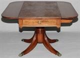 Lot#66, DUNCAN PHYFE STYLE, MAHOGANY DROP LEAF TABLE, H 27" W 24", (44" OPEN), D 24"Two drop leaf table, having one side drawer with brass pull. Raised on a pedestal base, with curved legs and brass paw feet. Each leaf measures W. 10", and 44" when opened; folded down table is 24" W.