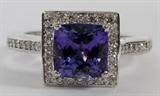 Lot#90, 2.22CT TANZANITE & DIAMOND LADIES RING, SIZE 6.5//14kt white gold ladies ring, featuring a 2.22 carat cushion shaped natural tanzanite prong at the center, surrounded by 0.50 carats of round side diamonds. Measuring approximately 6.1 grams in total weight, size 6.5. The diamonds have a G-color, VS-2 clarity grading.
