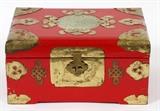 Lot#142, CHINESE RED LACQUER JEWELRY BOX, H 4 1/2" L 9" D 6 1/4"//Fitted with gilt metal hardware, having a center pierce carved jade medallion at the hinged lid, opening to a yellow silk interior. Original paper labels at underside, made in Hong Kong.