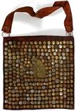 Lot#247, MOROCCAN LEATHER WATER SELLER'S BAG, W 20" L 39"Decorated with assorted Moroccan, American, Canadian, and European coins; some of which include Republique Francaise coins, Moroccan Franc coins, a 1950 Bundesrepublia Deutschland Pfennig coin, together with more.
