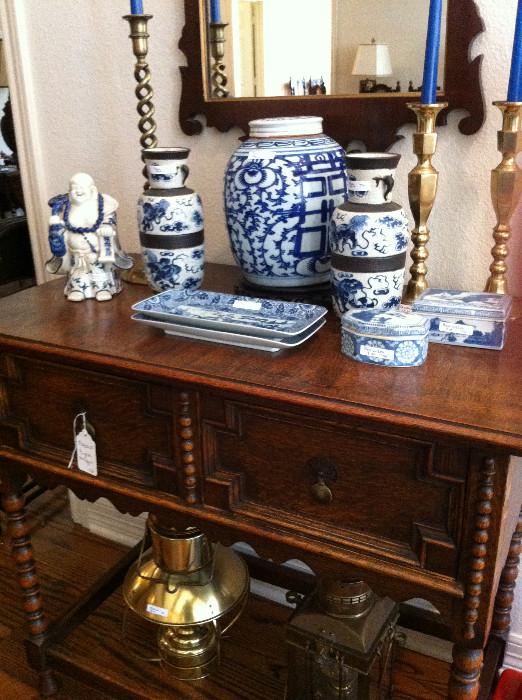 many blue & white items; lovely sideboard/server; lanterns; brass candle sticks; decorative mirror