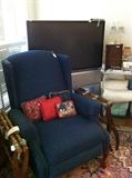      blue fabric wing-back chair; TV; 2 luggage racks