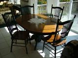 Kitchen /Dining oval shaped table. Pedestal Base. 4 chairs. nice condition. This set features Oak with forest green accent.