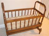 Antique turned baby bed in walnut with original mattress from Bloomington, IL