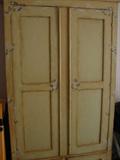 Antique wardrobe - has been embellished in yellow with daisies inside & out