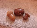 Acorn thimble caddies and a small barrel for thread