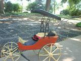 Wonderful pram with fringed hood for dolly!