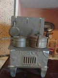 Miniature tin stove with kettle, pan, & skillet