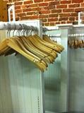 fantastic; white display racks; many wooden hangers