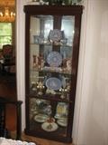 Corner display cabinet with Wedgewood, Goebel and more