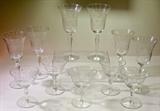 Crystal stemware with cut dot and leaf motif.