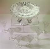 Mardi Gras (George Duncan & Sons #42) EAPG cake stand with raised rim (one of pair). Set of six EAPG trumpet shape cordial glasses in a different pattern.