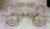 Limoges floral pattern bouillion set of handled cups with underplates. 