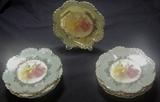 Set of lusterware dessert plates with orchids.