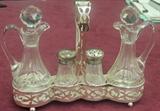 Vicotorian castor set in Gorham sterling frame, pair cruets, salt and pepper shakers.