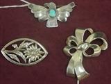Selection from sterling silver pins-Beau floral in navette shaped frame, native American eagle/thunderbird with turquoise, 40's stylized ribbon/corsage/bow pin. 