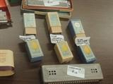 Selection from harmonica collection, most with boxes.