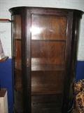 Curio cabinet with curved glass