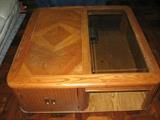 Square oak parquet coffee table with partial glass top and storage area underneath