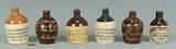 Several miniature advertising jugs