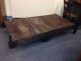 Railroad cart with original wood and rare rubber wheels.