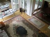 Overview of room with Ethan Allen Chinoiserie table, end table, china, dining room wool rug, small area rug.