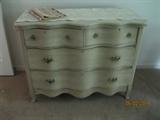 Painted vintage chest with serpentine front.