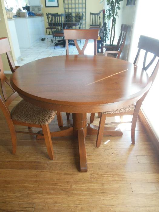 Walter E Smith Light Cherry Round Dining Table has 1 leaf 2 Arm Chairs,4 Side