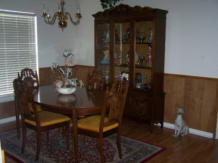 Dining room table 6 chairs, china cabinet.  Dog statue is not for sale.