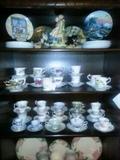 some of the teacups displayed in another Ercol cabinet