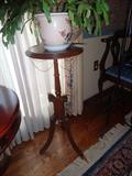 A small cherry finish table.  Great for holding plants.