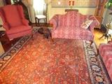 A beautiful predominantly red oriental rug.
