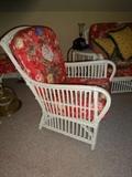 Photo 1 of 3: A set of white Rattan chairs with cushions in a red floral pattern.