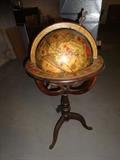 An antique style globe that would be perfect for a study, office, or library.