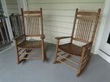 A pair of wooden rocking chairs that are perfect for any front porch!