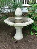 A stone bird bath