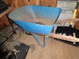A blue metal wheelbarrow