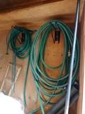 A pair of green hoses