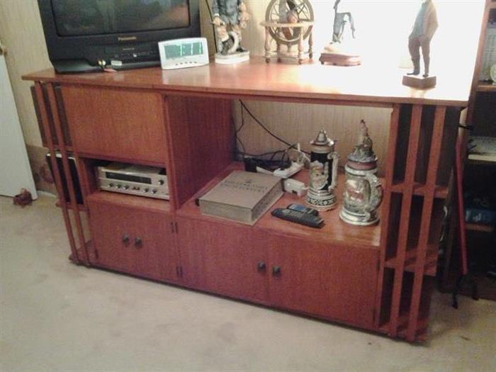 Solid Mahogany Unit with storage.  Also available is a turntable, receiver, DVD Player.  Steins are from Germany